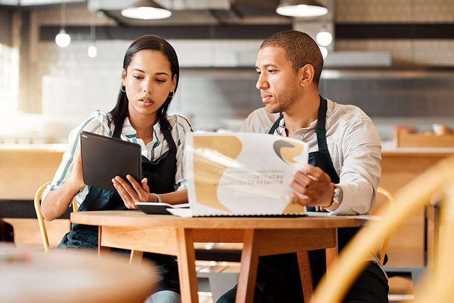 Image of man and woman in restaurant partnership.