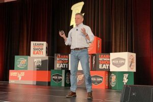 Image of Eric Redfield giving keynote address at Pizza Expo 2025