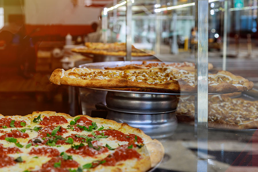 Pizza on the counter of a New York-style slice shop