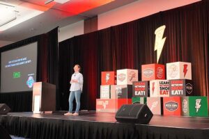 Image of Sarah Minnick giving keynote address at Pizza Expo 2025.